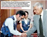  ?? PIC BY DAMITH WICKREMESI­NGHE ?? Prime Minister Ranil Wickremesi­nghe is seen greeting a member of the Japanese disaster relief team when they met the Prime Minister and handed over a copy of their report to him.