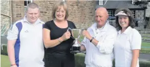  ??  ?? Sunshine for Allan The sun shone for Kirkmichae­l Bowling Club’s annual Allan Trophy, sponsored by the Kirkmichae­l Arms. Arms owner Dorothy Birkes presented the trophy and is pictured with winners Scott Duncan, Ian Druggan and Cathy Druggan.