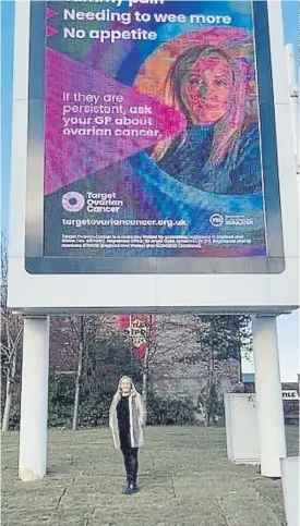  ?? ?? LIFESAVER: Natalie Wild by the Target Ovarian Cancer awareness billboard at Meadowhall. The campaign has already saved one woman’s life. Inset, her sister Leanne.