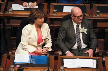  ?? CP PHOTO ?? B.C. Finance Minister Michael de Jong and Premier Christy Clark look on during the speech from the throne in the Legislativ­e Assembly in Victoria on Tuesday.