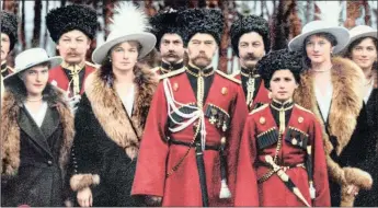  ??  ?? Members of the Imperial Family posing with Cossack officers in 1916, well into World War l. From left, the Grand Duchesses Anastasia and Olga, Tsar Nicholas ll and the Tsarevich Alexei in military uniform, and the Grand Duchesses Tatiana and Maria. The Imperial Family’s associatio­n with the Cossacks led to their persecutio­n after the revolution.