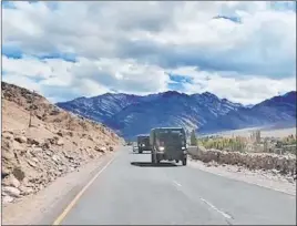  ?? The Associated Press ?? An Indian army convoy is on the move in Leh, India. India and China accused each other on Tuesday of making military moves Monday along their disputed border.