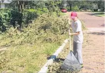  ?? STEPHEN HUDAK/STAFF ?? Above, Ana D’Estrada of Winter Park rakes storm debris into a pile in Winter Park. At left, debris sits in a Longwood community.