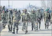  ?? ANI ?? Security personnel inspect a spot after a shootout in Srinagar.