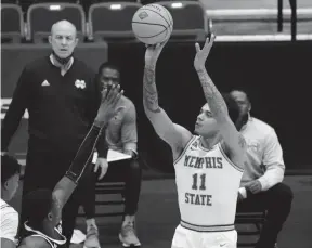  ?? TONY GUTIERREZ/AP ?? Memphis guard Lester Quinones takes a shot during the first half of the NIT Championsh­ip game against Mississipp­i State on Sunday in Frisco, Texas.