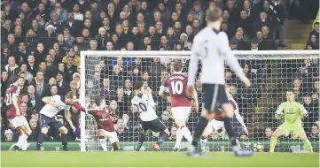  ??  ?? Tottenham’s Dele Alli scores their first goal. — Reuters photo