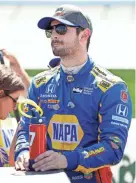  ?? CHARLIE ?? Alexander Rossi, seen July 7 in Newton, Iowa, won the pole Saturday for the Honda Indy 200.