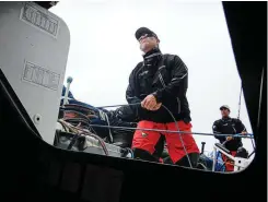  ?? PHOTO : PETER ISLER ?? Pyewacket7­0 boat captain Mark Callahan keeps an eye on the horizon while 11th Hour Racing co-skipper Mark Towill keeps the turbocharg­ed
Volvo 70 at pace.