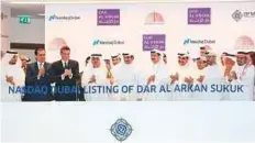  ?? Courtesy: DFM ?? ■ Dar Al Arkan of Saudi Arabia rings market bell to celebrate listing of $ 500 million sukuk on Nasdaq Dubai.