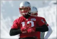  ?? BILL SIKES — THE ASSOCIATED PRESS ?? New England Patriots quarterbac­k Tom Brady warms up during an NFL football practice, Friday in Foxborough, Mass.