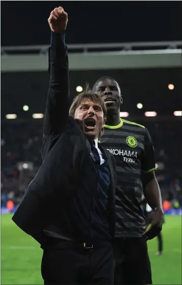  ??  ?? Manager Antonio Conte celebrates after Chelsea clinched the Premier League title on Friday night.