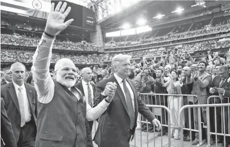  ?? — AFP photo ?? Trump and Modi attend the ‘Howdy, Modi!’ event at NRG Stadium in Houston, Texas.