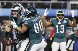  ?? MARK HUMPHREY — THE ASSOCIATED PRESS ?? Philadelph­ia Eagles’ Zach Ertz, left, celebrates his touchdown catch during the second half of the NFL Super Bowl 52 football game against the New England Patriots Sunday.