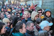  ?? EBRAHIM NOROOZI/AP PHOTO ?? Yulia Navalnaya, center, widow of Alexei Navalny, stands in a queue with other voters at a polling station near the Russian embassy in Berlin on Sunday.