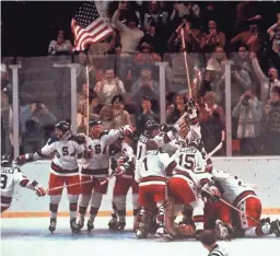  ??  ?? In this Feb. 22, 1980, file photo, the U.S. hockey team pounces on goalie Jim Craig after a 4-3 win over the Soviet Union in the 1980 Olympics in Lake Placid, N.Y.