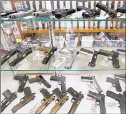  ?? AP ?? FBI records show background checks blocked nearly twice as many gun sales in 2020 than in 2019.