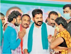  ?? DC ?? TPCC president A. Revanth Reddy interacts with villagers during the Dalit Girijana Atma Gaurava meeting held in Muduchinth­alapally in Medchal Malkajgiri district on Wednesday .
—