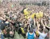  ?? JACOB LANGSTON/STAFF FILE PHOTO ?? Knightro, UCF’s mascot, crowd surfs over students at the Reflecting Pond for Spirit Splash.