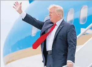  ?? AP PHOTO ?? U.S. President Donald Trump waves after arriving on Air Force One at Miami Internatio­nal Airport in Miami Friday.