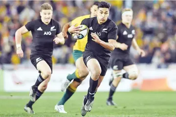  ?? — AFP photo ?? New Zealand’s wing Rieko Ioane scores a try during the Rugby Championsh­ip test match between Australia and the New Zealand All Blacks in Sydney on August 19, 2017.
