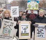  ?? CLIFFORD SKARSTEDT EXAMINER ?? Protesters attend a rally against the Trans Mountain Pipeline expansion outside MPP Maryam Monsef’s constituen­cy office on Wednesday following a march.