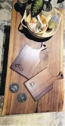  ?? ?? Cutting boards made from mansonia (African wood), seen here on a black walnut coffee table, are among the many items crafted by Gerry Payne’s hand at Dusty Moustache Creations.