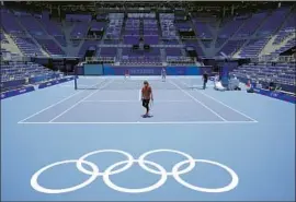  ?? Kiichiro Sato Associated Press ?? NAOMI OSAKA, the No. 2-ranked female tennis player in the world, gets in some practice at the Ariake Tennis Park on Monday before the Summer Olympics.