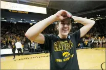  ?? CHARLIE NEIBERGALL — THE ASSOCIATED PRESS ?? Iowa guard Caitlin Clark (22) celebrates after the Hawkeyes beat Michigan to claim a share of the Big Ten regular season title.