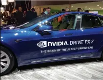  ??  ?? Semiconduc­tor chip companies such as Nvidia and Intel create the “brains” of self-driving cars.