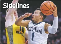  ?? LAURENCE KESTERSON/THE ASSOCIATED PRESS ?? Villanova guard Jalen Brunson, right, goes to the basket as Marquette guard Sam Hauser defends during Saturday’s game in Philadelph­ia. Villanova is back at the top of the latest AP Top 25 poll.