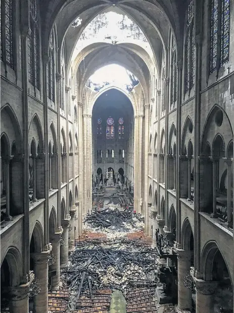  ?? Picture: AFP ?? DUST AND ASHES The interior of Notre Dame de Paris after the fire, which destroyed the entire roof, made of solid oak beams.