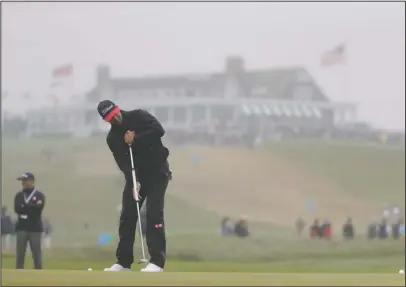  ?? The Associated Press ?? QUESTION TIME: Adam Scott putts on the first green at Shinnecock Hills Golf Club in Southampto­n, N.Y., Wednesday ahead of the 118th U.S. Open that begins today.