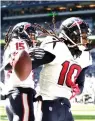  ?? Michael Conroy/AP ?? ■ Houston Texans wide receiver DeAndre Hopkins (10) celebrates a touchdown reception with Will Fuller (15) during the first half of an NFL game Sunday against the Indianapol­is Colts, in Indianapol­is.