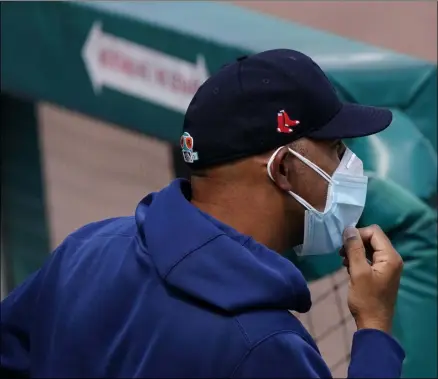  ?? JOHN BAZEMORE - THE ASSOCIATED PRESS ?? Boston Red Sox manager Alex Cora watches from the dugout during a spring training baseball game against the Atlanta Braves, Wednesday, March 10, 2021, in Fort Myers, Fla.