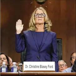  ?? WIN MCNAMEE / ABACA PRESS / TNS ?? CHRISTINE BLASEY FORD is sworn in before testifying in front of the Senate Judiciary Committee on Thursday.