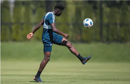  ?? CP PHOTO ?? Vancouver Whitecaps midfielder Alphonso Davies kicks a ball during MLS soccer team practice in Vancouver on Monday.