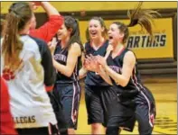  ?? AUSTIN HERTZOG — DIGITAL FIRST MEDIA ?? Boyertown’s Avery Sweisfort, right, and Katie Armstrong, second from right, celebrate after defeating Cumberland Valley 50-35 last Friday night in Hershey.