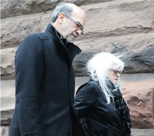  ?? COLIN PERKEL / THE CANADIAN PRESS ?? David Livingston and his wife Anne Grittani arrive at Toronto court on Monday.