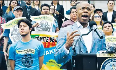  ?? AP/BEBETO MATTHEWS ?? Martin Batalla Vidal (front left), who came to the U.S. with his parents when he was 7, listens Thursday as Brooklyn Borough President Eric Adams (front right) address a coalition rally of legal and civil rights groups going to court to challenge...