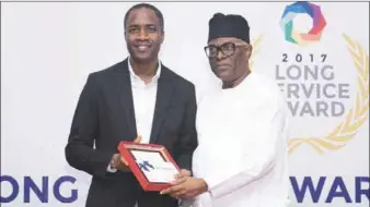  ??  ?? Group Chief Operating Officer, Nosak Group, Thomas Oloriegbe and Chairman, Nosak Group, Dr.Toni Ogunbor at the Long Service Awards of Nosak Group held recently in Lagos