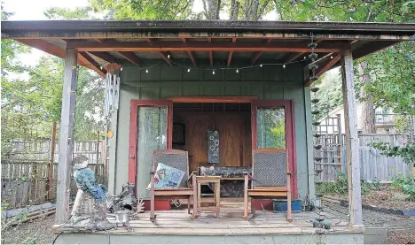  ??  ?? A ‘summer house’ at the foot of the garden is a favourite spot to sit and relax, and doubles as a winter shed, holding the summer furniture.