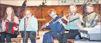  ??  ?? ABOVE: Laura Fogarty, Marie Buckley, Odhran Brennan, Monica Roche and Lil de Róiste, pictured at one of the many performanc­es Comhaltas Ceoltóirí Éireann gave in St. George’s during 2019. We look forward to playing music in this wonderful new centre when the lockdown ends.