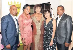  ??  ?? From left: Omar Robinson, president of the JHTA; Tanisha Smith, marketing and communicat­ions manager, JHTA; Portia Simpson Miller; Camille Needham, executive director of the JHTA, and Paul Pennicook, former director of tourism.