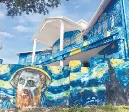  ?? JERRY FALLSTROM/STAFF ?? Lubomir Jastrzebsk­i and Nancy Nemhauser are fighting to keep the mural of Vincent van Gogh’s “Starry Night” that covers their Mount Dora home, saying that the images help soothe their autistic son. They’ve been fined more than $9,000 for violation of...