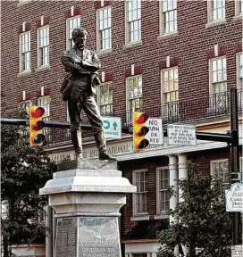  ?? Pete Souza / KRT ?? The Confederat­e Statue of a standing Rebel soldier in the Old Town section is one of Alexandria’s most prominent and controvers­ial landmarks. Dedicated in 1889, it bears the names of 99 Alexandria­ns who gave their lives in the Civil War.