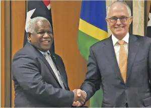  ??  ?? The Solomons Prime Minister Rick Houenipwel­a with Malcolm Turnbull in Canberra on June 13, 2018.