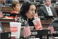  ?? Jessica Hill / Associated Press file photo ?? State Rep. Anne Dauphinais R-Killingly, takes a sip from a soda as Gov. Ned Lamont delivers his budget address at the state Capitol in Hartford on Feb. 20, 2019.