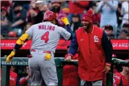  ?? AP PHOTO BY TONY AVELAR ?? St. Louis Cardinals’ Yadier Molina (4) is congratula­ted by Albert Pujols, right, after hitting a solo home run against the San Francisco Giants during the third inning of a baseball game Thursday, May 5, 2022, in San Francisco.