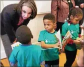  ?? SUBMITTED PHOTO ?? Carra CoteAckah, director of Vanguard’s Community Stewardshi­p efforts, speaks with children and families at the Drexel Dornsife Center for Neighborho­od Partnershi­ps.