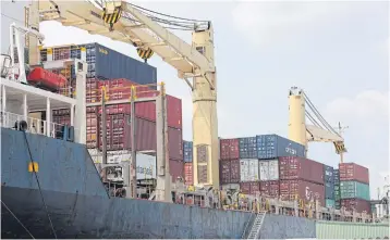  ?? TAWATCHAI KEMGUMNERD ?? A container vessel docked at the Bangkok Port. Thailand’s exports rose for the third straight month in January thanks to the recovery of world trade and rising oil prices.